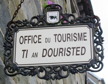 Pictured is the Sign at the Tourism Office in Carhaix, Brittany ... the place where tourists can stop in and find out about tourist attractions and tour information.   Photo by Man Vyi.